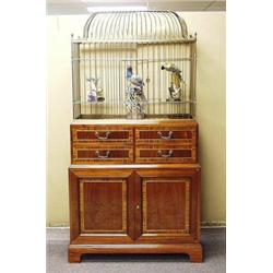 A fine English satinwood and brass inlaid bird cage and supporting cabinet in the transitional st…