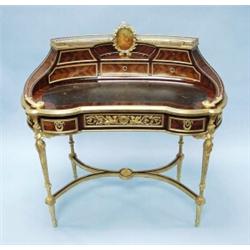 An important antique French Empire style parquetry inlaid mahogany and gilt bronze bureau-de-dame…
