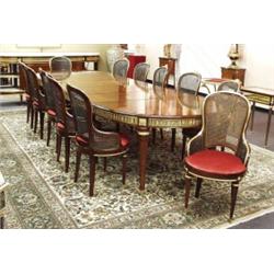 A magnificent antique French Louis XVI style fruitwood dining or boardroom table with 12 matching…