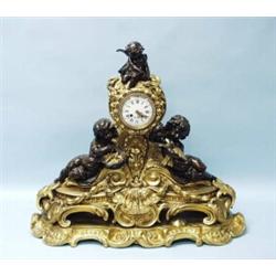 A monumental antique French Louis XV style gilt bronze mantel clock. Cylindrical gilt case mounte…