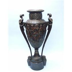 A monumental antique French bronze patinated floor vase. The campagna form vase with elongated ne…