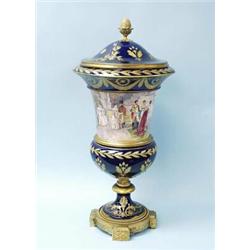 An important antique French Sevres porcelain covered vase. Handpainted by Lucot with a colourful …