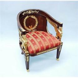 An important antique French Empire fauteil with gilt bronze mountings. The finely carved mahogany…