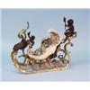 An unusual antique French hand painted faience centerpiece in form of a sleigh. Gilt bronze mount…