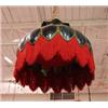 An early 20th century American leaded glass hanging lamp. The gilt metal frame inset with facette…