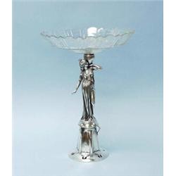 An early 20th century WMF silverplated and crystal centerpiece. The cut crystal top tray raised o…
