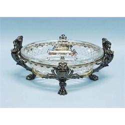 CHRISTOFLE, PARIS - An antique silver patinated bronze centrepiece with fitted cut glass liner. F…