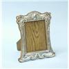 Image 1 : ARTS AND CRAFTS - An English sterling silver and oakwood easel picture frame. 8" x 7". Fully mark…