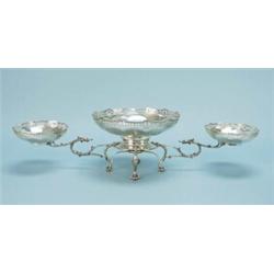 An English sterling silver centrepiece in form of a wirework stand supporting three facetted bowl…