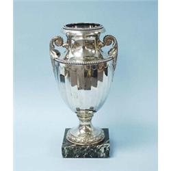 EMILE PUIFORCAT - An antique French campagna form Empire style silver vase with two scrolled leaf…