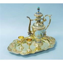 A Chinese gilt silver liqueur set comprising an oval tray, decanter and matching tumblers. Each p…