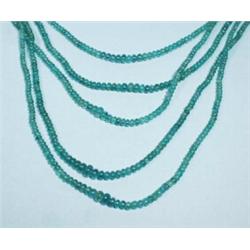 A five strand natural emerald bead necklace with 14 kt. yellow gold clasp.…