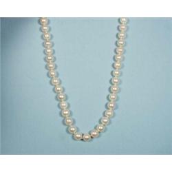 A fine 8-8.5 mm. cultured pearl necklace with diamond set 18 kt. gold clasp. Marked. 32" long. Fi…