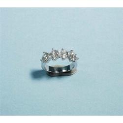 An unusual 18 kt. white gold and diamond band ring. Set with 13 round brilliant cut diamonds in t…