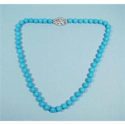 A fine 8 - 8.5 mm turquoise bead necklace with a diamond set 18 kt. white gold clasp.…
