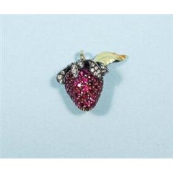 A delicate 18 kt. yellow gold, ruby and diamond pendant with a floral leaf ornament. Hallmarked.…