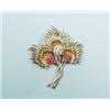 Image 1 : TIFFANY, NEW YORK - A very good 18 kt. gold, diamond and ruby brooch. Three intertwined floral br…