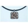 Image 1 : An unusual 18 kt. white gold and diamond pendant on an 18 kt. white gold mounted vulcanized rubbe…