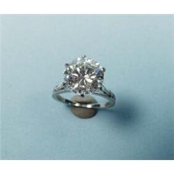 An important platinum and diamond solitaire set with a brilliant cut diamond, 4.65 cts, very fine…