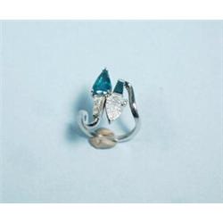 A handmade platinum, emerald and diamond ring of contemporary design. Set with a fine pear-shaped…
