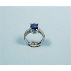 An elegant platinum and diamond ring set with an exceptional natural sapphire, scale weight 4.07 …