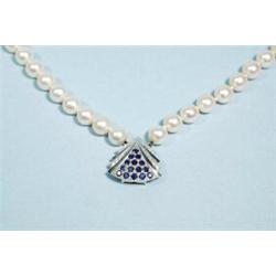 An 8 - 8.5 mm double stranded cultured pearl necklace with an interesting sapphire and diamond se…