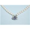 An 8 - 8.5 mm double stranded cultured pearl necklace with an interesting sapphire and diamond se…