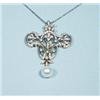 A Belle Epoque design 18 kt. white gold and diamond pendant with matching gold chain. The shield …