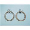 Image 1 : A pair of 18 kt. yellow and white gold hoop earrings. Set with a combination of white and champag…