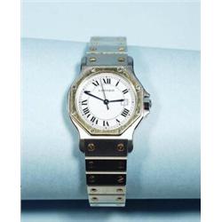 Cartier - Santos. A stainless steel and 18 kt. yellow gold ladies wristwatch. Fully marked, origi…