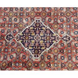 A Persian Malayer wool carpet. Approx. size: 3'5" x 4'10".…