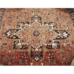 A semi-antique Persian Heriz carpet. Approx. size: 7'10" x 11'7".…