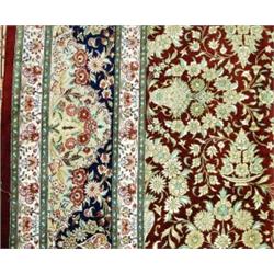 A semi-antique Persian Qum silk carpet. Signed. Appx. size: 9'9" x 6'5".…