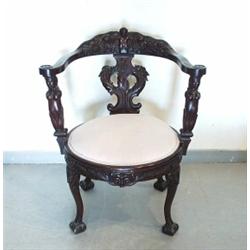 An unusual carved mahogany arm chair. Back rest with supports carved in form of mermaids. Seat up…