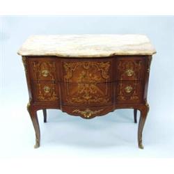 A Louis XV style petit commode. Fitted with three small drawers with floral marquetry decoration.…