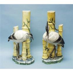 An unusual pair of antique Austrian handpainted faience floor vases in form of stylized bamboo st…