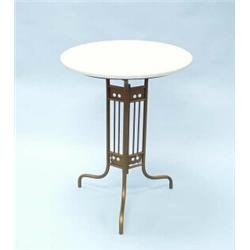 JUGENDSTIL - AUSTRIA. A gold painted wrought iron garden set comprising a circular table with whi…