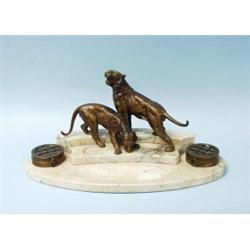 ART DECO - An unusual French bronze and marble inkwell. The kidney shaped marble base with two po…