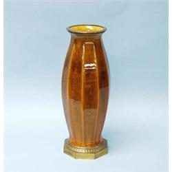 ART DECO - SEVRES. A fine French porcelain vase with gilt metal base. The facetted vessel with fi…