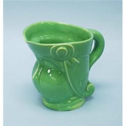 ART DECO - PRIMAVERA, FRANCE. An unusual faience wine pitcher in form of a grotesque head. With f…