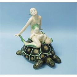 LENCI - "Mama Sirena". A rare hand painted faience figural group in form of a turtle with a merma…