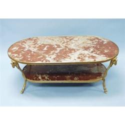 A very good French Empire style gilt bronze and marble 2-tier low table. Oval top and stretcher w…
