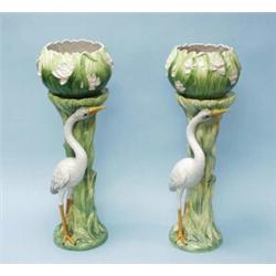 A pair of handpainted French faience jardinieres with matching pedestals made for Chaumette, Pari…