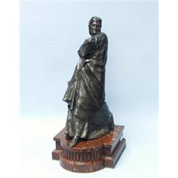 Dante. A French brown patinated bronze figure of the poet. Mounted on rouge marble shaped plynth.…