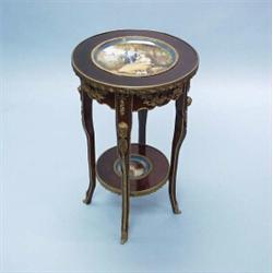 A very good antique French two tier occasional table with hand painted Sevres porcelain inlays an…