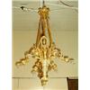Image 1 : A large antique French bronze dore chandelier. The torch form base with six scrolled arms decorat…