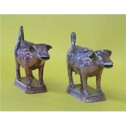 TWO LUSTERWARE COW CREAMERS AND COVERS, English. Circa 1830. Each with purplish glaze and cream...