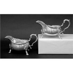 ASSEMBLED PAIR OF EDWARDIAN STERLING SILVER SAUCE BOATS, English. London. 1904 and 1906. Maker:...