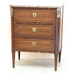 DIRECTOIRE STYLE GILT BRONZE MOUNTED MAHOGANY COMMODE, French. Early 19th Century. The D-shaped...