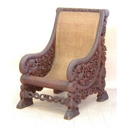 INTRICATELY CARVED ANGLO INDIAN WOOD ARM CHAIR, 19th Century. The circular pierced top rail abo...